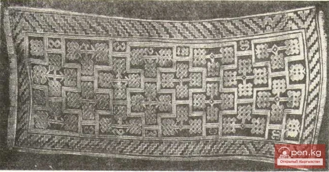 Piled carpet with cross-shaped ornament placement on the central field. Naukat district