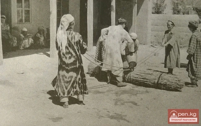 Rolling the alakiiza with additional watering. S. Merkut, Saliev Collective Farm, Naukat District, Osh Region, 1955