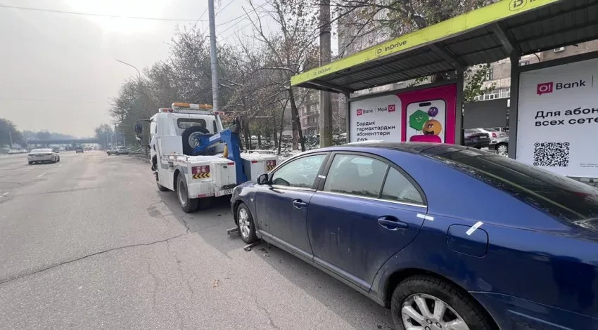 In Bishkek, cars are being towed to the impound lot for parking at bus stops