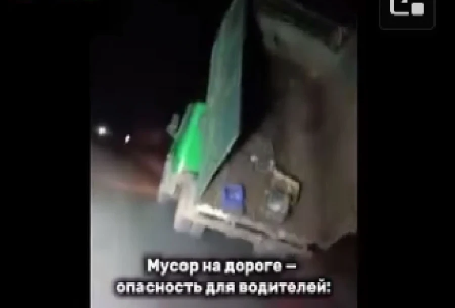 In Tokmak, garbage spilled onto the road from a truck