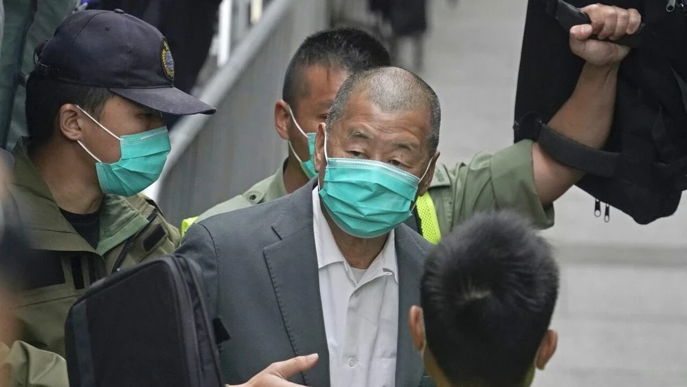 In Hong Kong, opposition media tycoon sentenced to 20 years in prison for incitement to rebellion