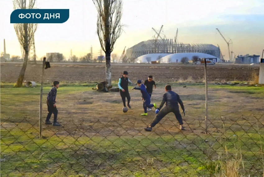 Photo of the Day. Children playing football against the backdrop of the under-construction "Bishkek Arena" stadium.
